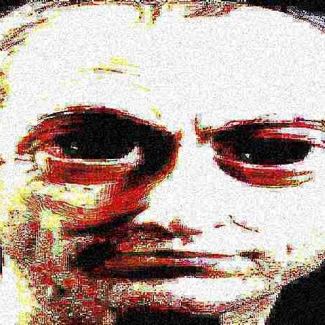 a heavily distorted dark image of a face in sunglasses
