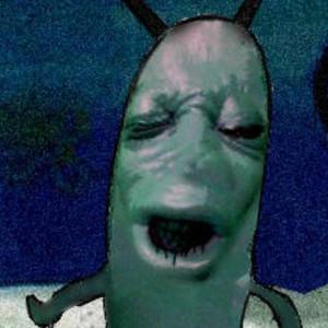 a green creature with antennae visibly crying
