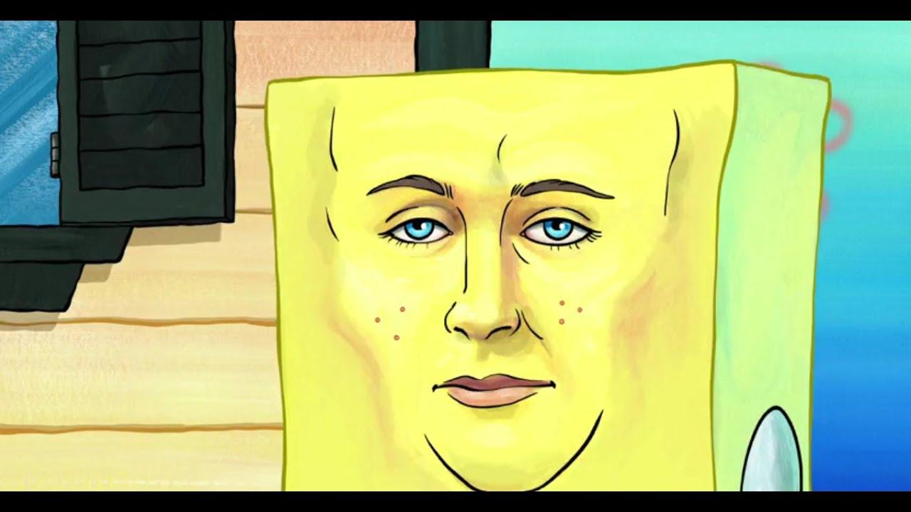 a square cartoon character with a strangely handsome and serious human face